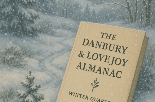 The Danbury & Lovejoy Almanac Winter 2026 resting in a snowy landscape with fir trees and falling snowflakes