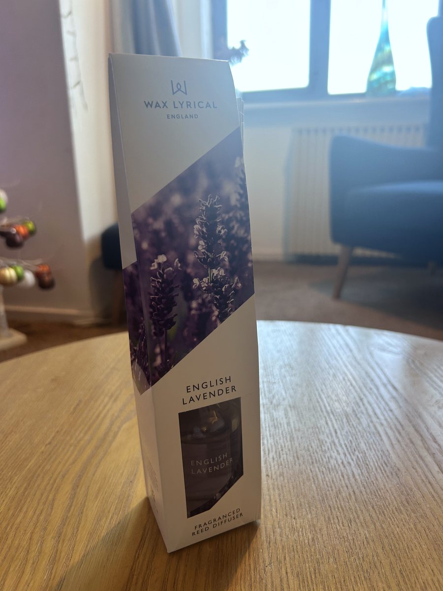 The Wax Lyrical English Lavender fragranced reed diffuser in its box on a wooden table